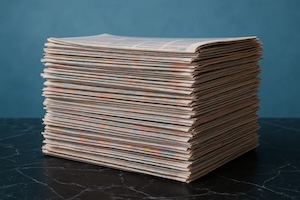 I Visa Media and Journalists, stack of newspapers